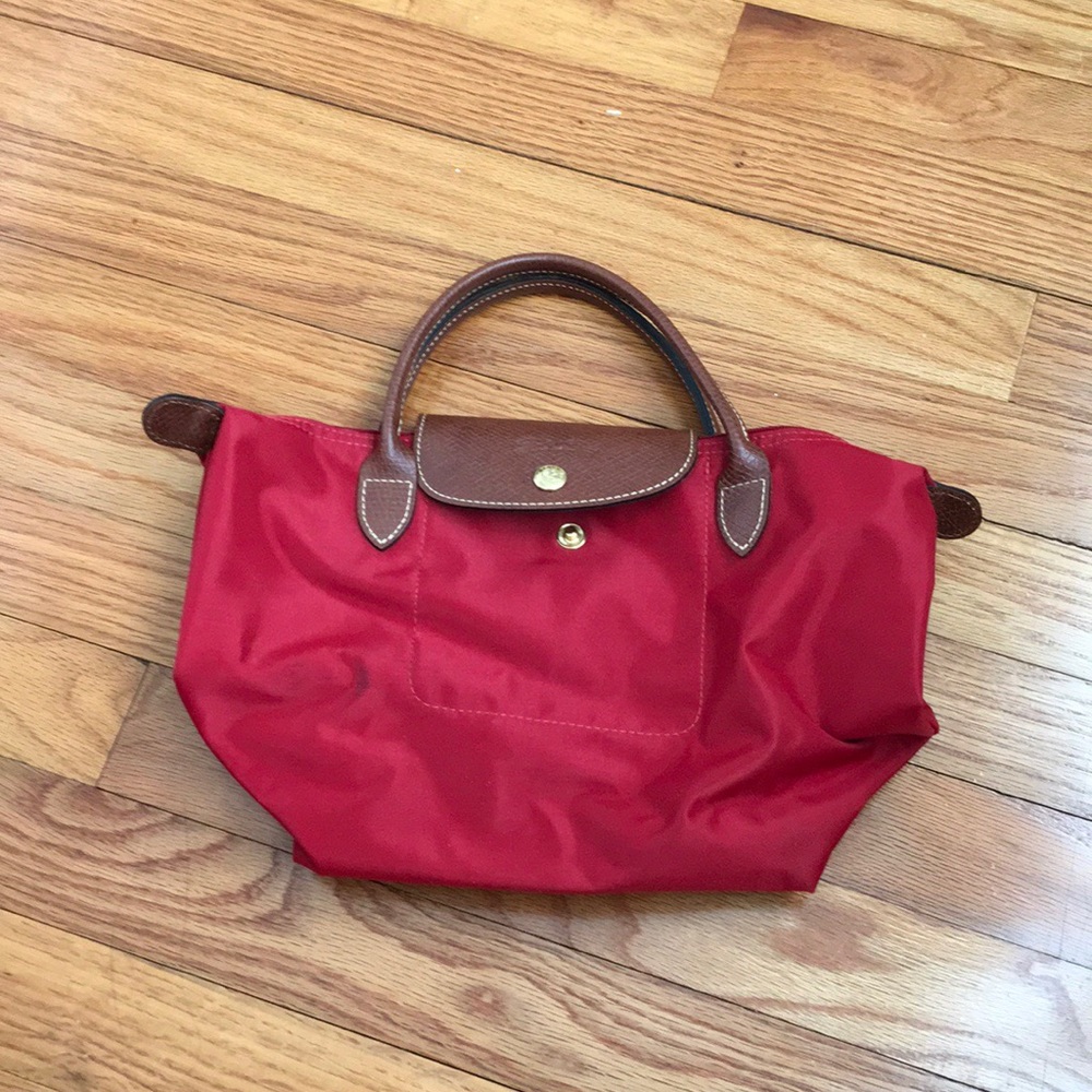 Small red Longchamp purse.